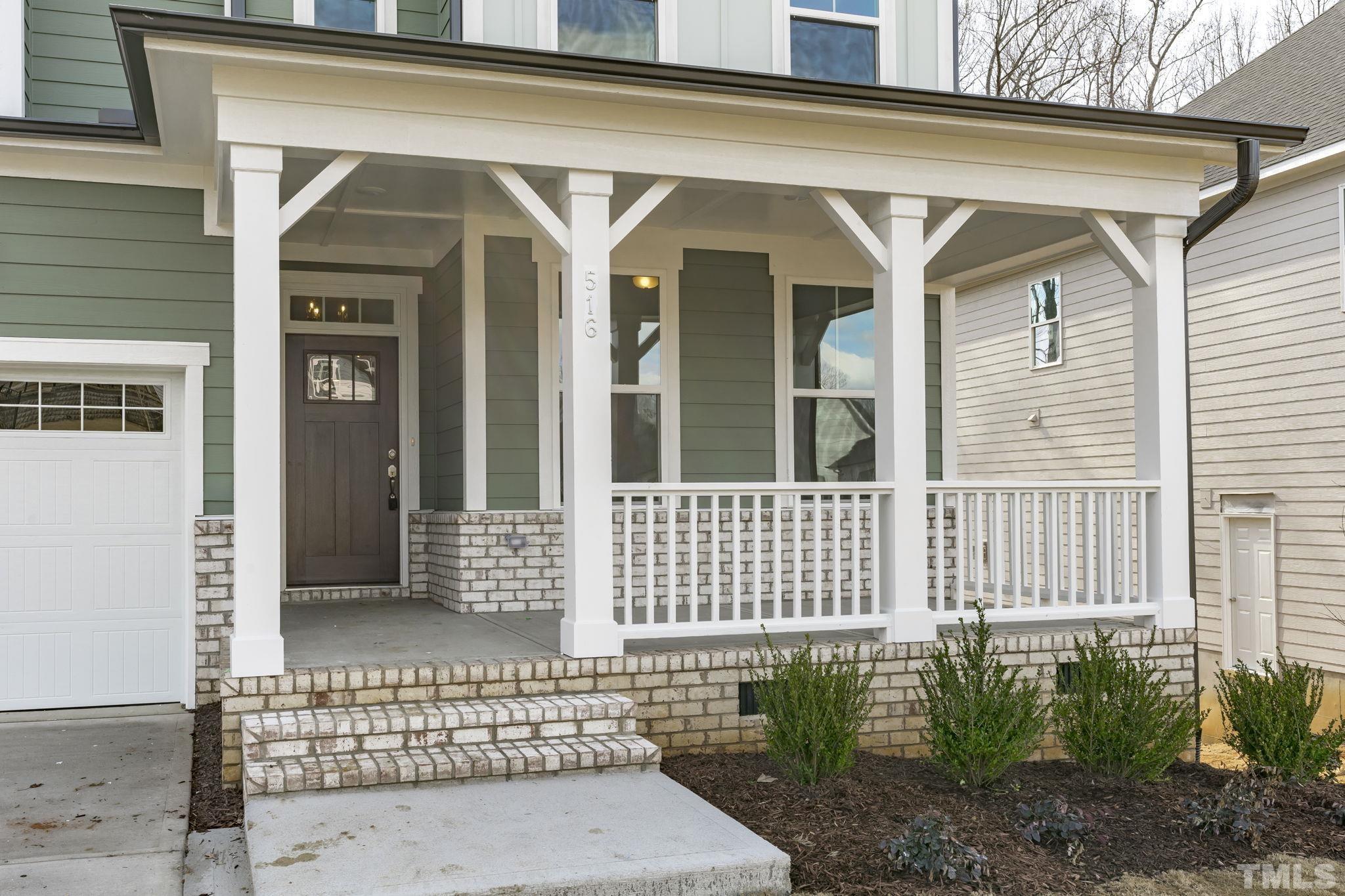516 Craftsman Rdg Trail Knightdale, NC 27545 - Photo 2 of 45 a front view of a house with a garden