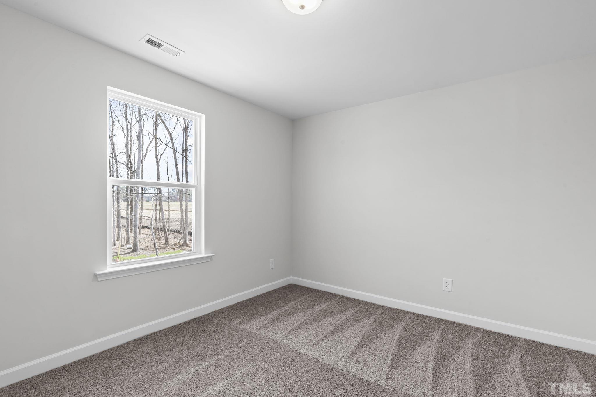 516 Craftsman Rdg Trail Knightdale, NC 27545 - Photo 27 of 45 an empty room with a window