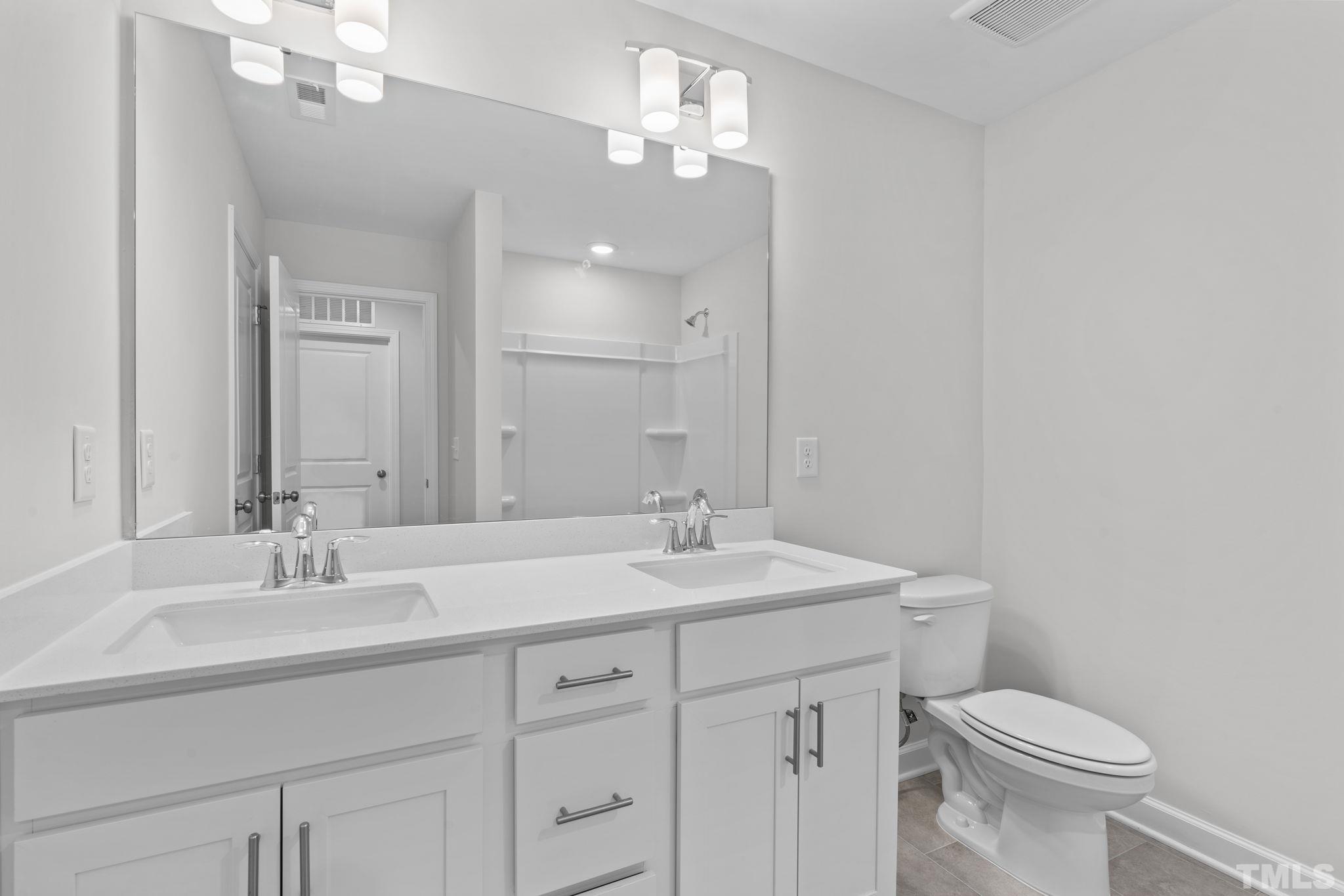 516 Craftsman Rdg Trail Knightdale, NC 27545 - Photo 34 of 45 a bathroom with a sink vanity granite and toilet