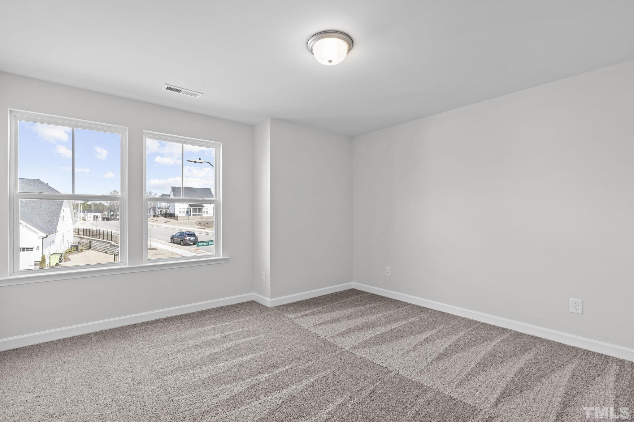 516 Craftsman Rdg Trail Knightdale, NC 27545 - Photo 35 of 45 an empty room with a window