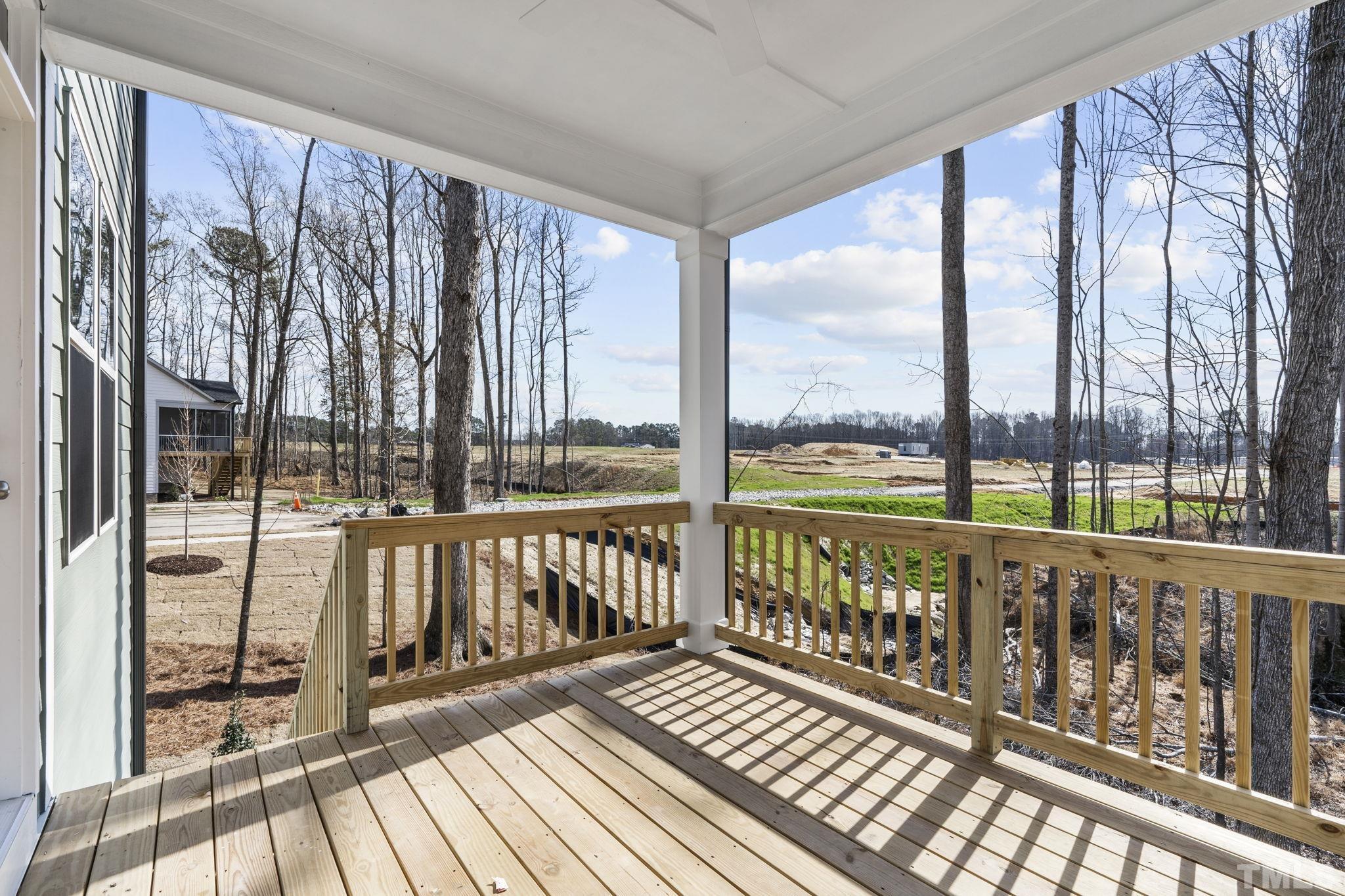 516 Craftsman Rdg Trail Knightdale, NC 27545 - Photo 40 of 45 a view of a porch with wooden floor and outdoor seating