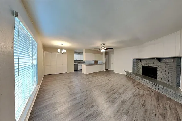 a view of a kitchen with a sink and a fireplace