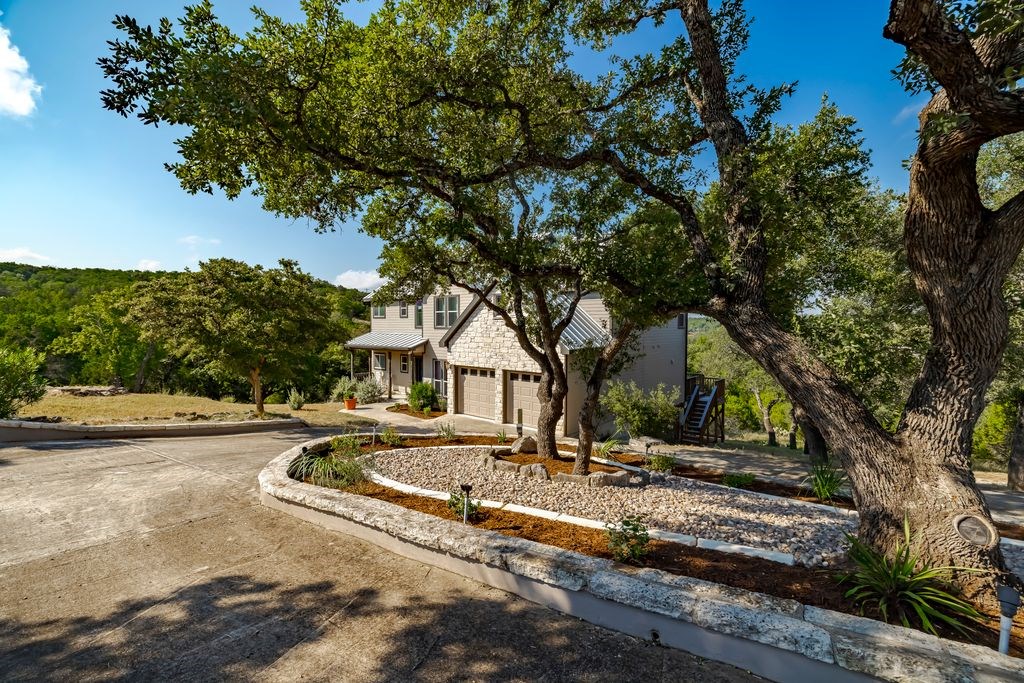 502 Lost Valley Kerrville, TX 78028 - Photo 4 of 70 a front view of a house with a yard