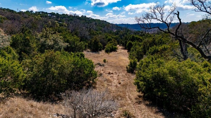 502 Lost Valley Kerrville, TX 78028 - Photo 54 of 70 a view of a forest with a house in a yard