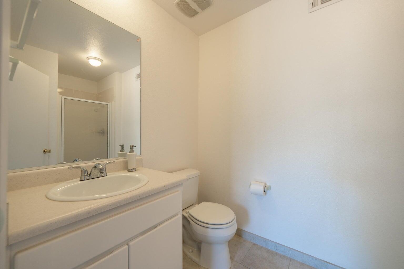 8846 Goldstone Lane Redding, CA 96001 - Photo 43 of 64 a bathroom with a sink toilet and a mirror