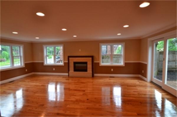 83 Cutter Hill Road Arlington, MA 02474 - Photo 3 of 22 a view of empty room with wooden floor and fireplace