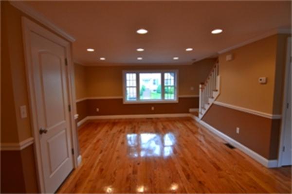 83 Cutter Hill Road Arlington, MA 02474 - Photo 4 of 22 a view of an empty room with wooden floor and a window
