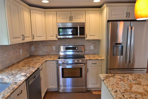 83 Cutter Hill Road Arlington, MA 02474 - Photo 5 of 22 a kitchen with granite countertop a sink stove and refrigerator