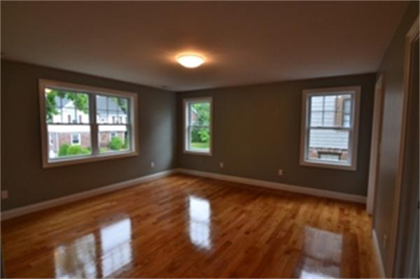 83 Cutter Hill Road Arlington, MA 02474 - Photo 8 of 22 a view of an empty room with wooden floor and a window