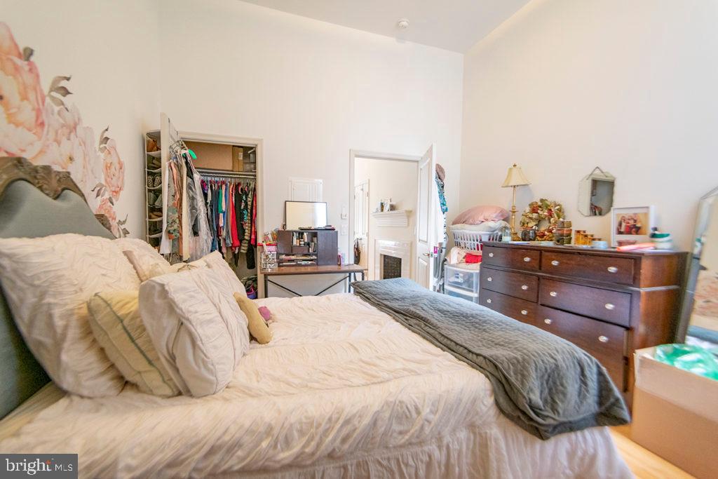 1310 Spruce Street, Unit 101 Philadelphia, PA 19107 - Photo 4 of 7 a bedroom with a bed and dresser