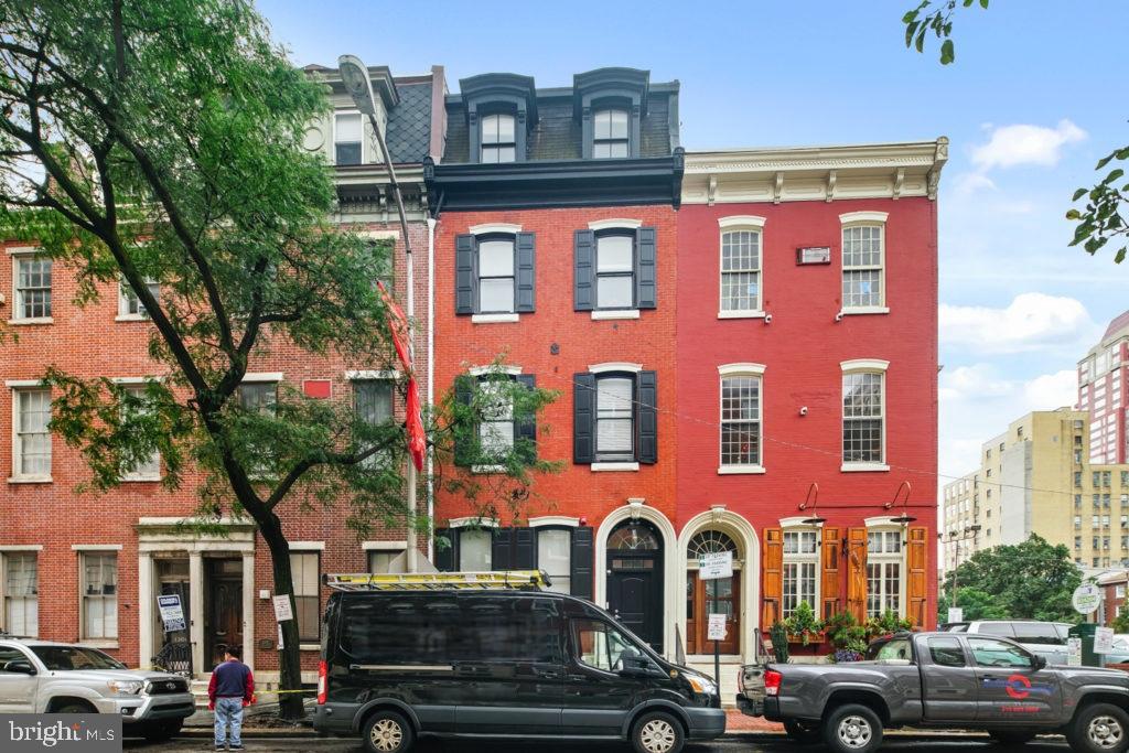 1310 Spruce Street, Unit 101 Philadelphia, PA 19107 - Photo 7 of 7 a couple of cars parked in front of a building