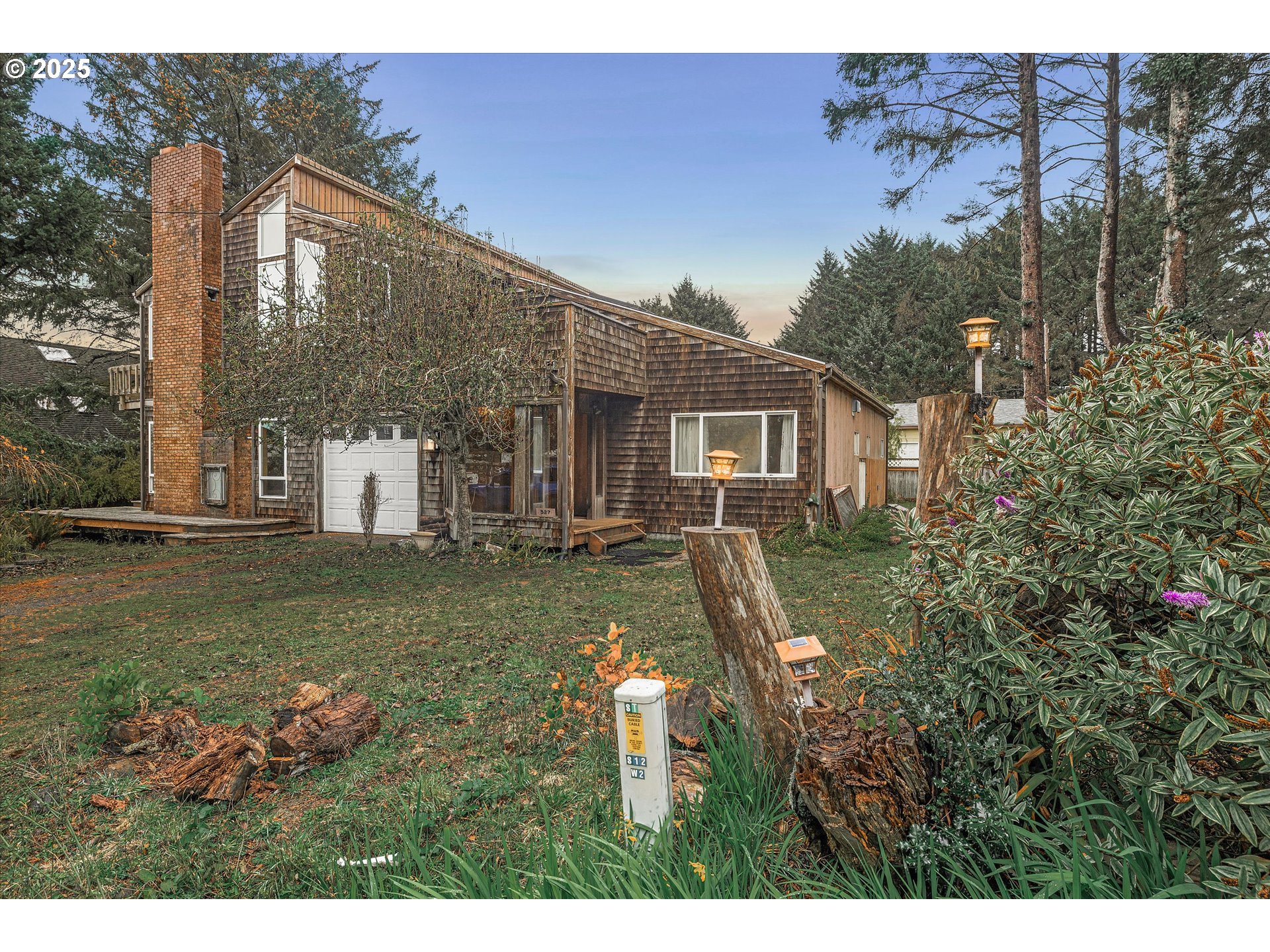 327 Lemwick Lane Yachats, OR 97498 - Photo 12 of 41 a view of a house with a yard