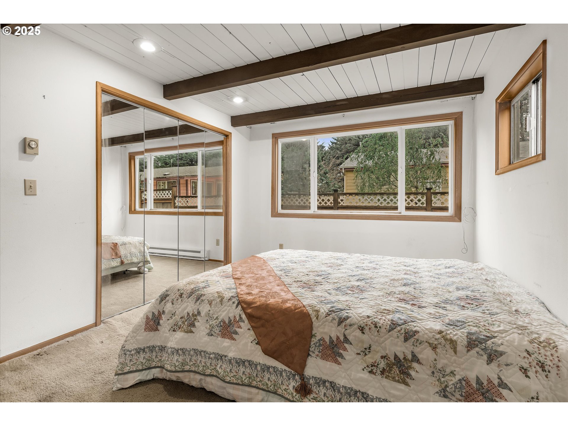 327 Lemwick Lane Yachats, OR 97498 - Photo 20 of 41 a bedroom with a bed window and dresser