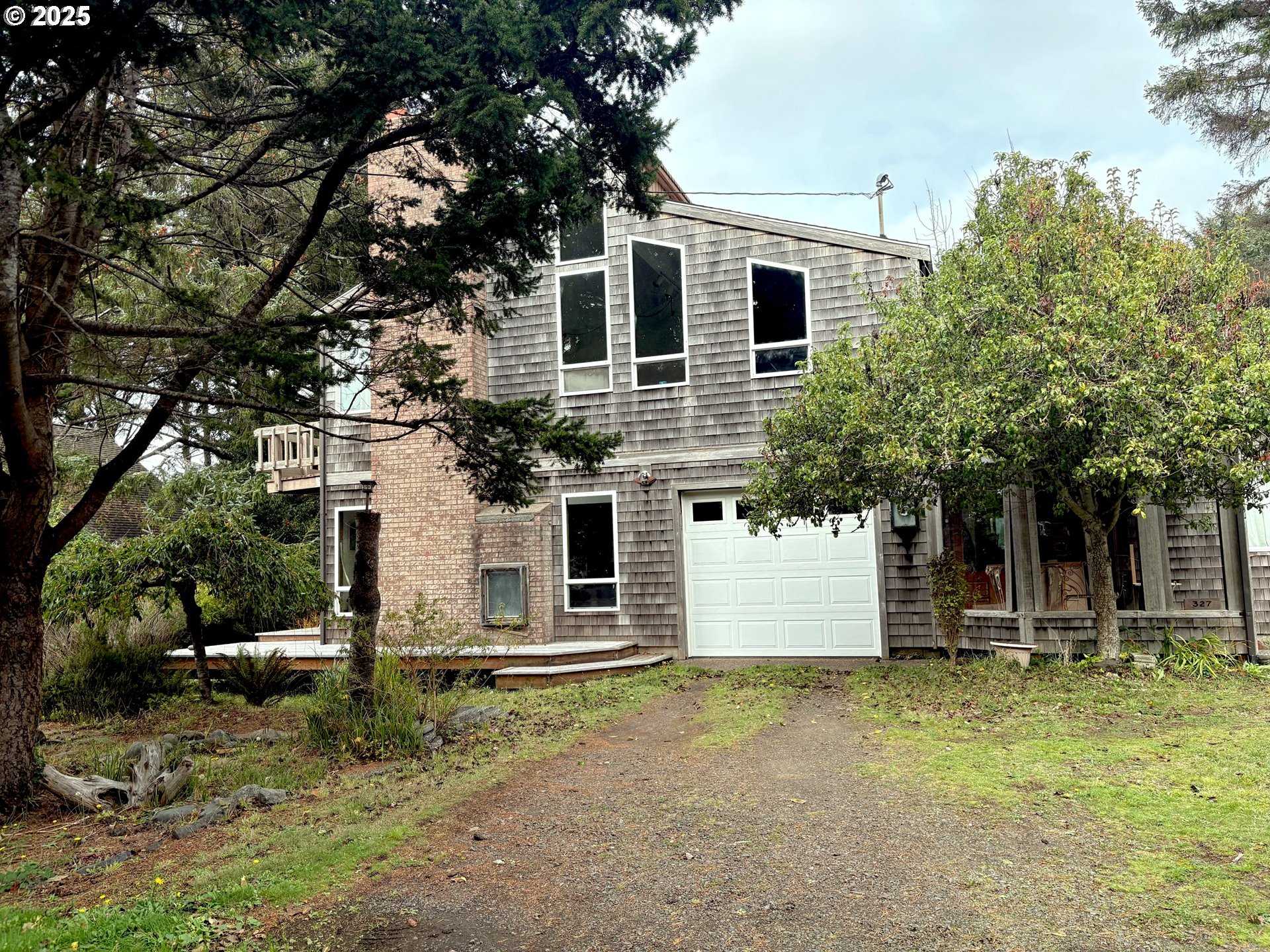 327 Lemwick Lane Yachats, OR 97498 - Photo 2 of 41 a view of a house with a yard