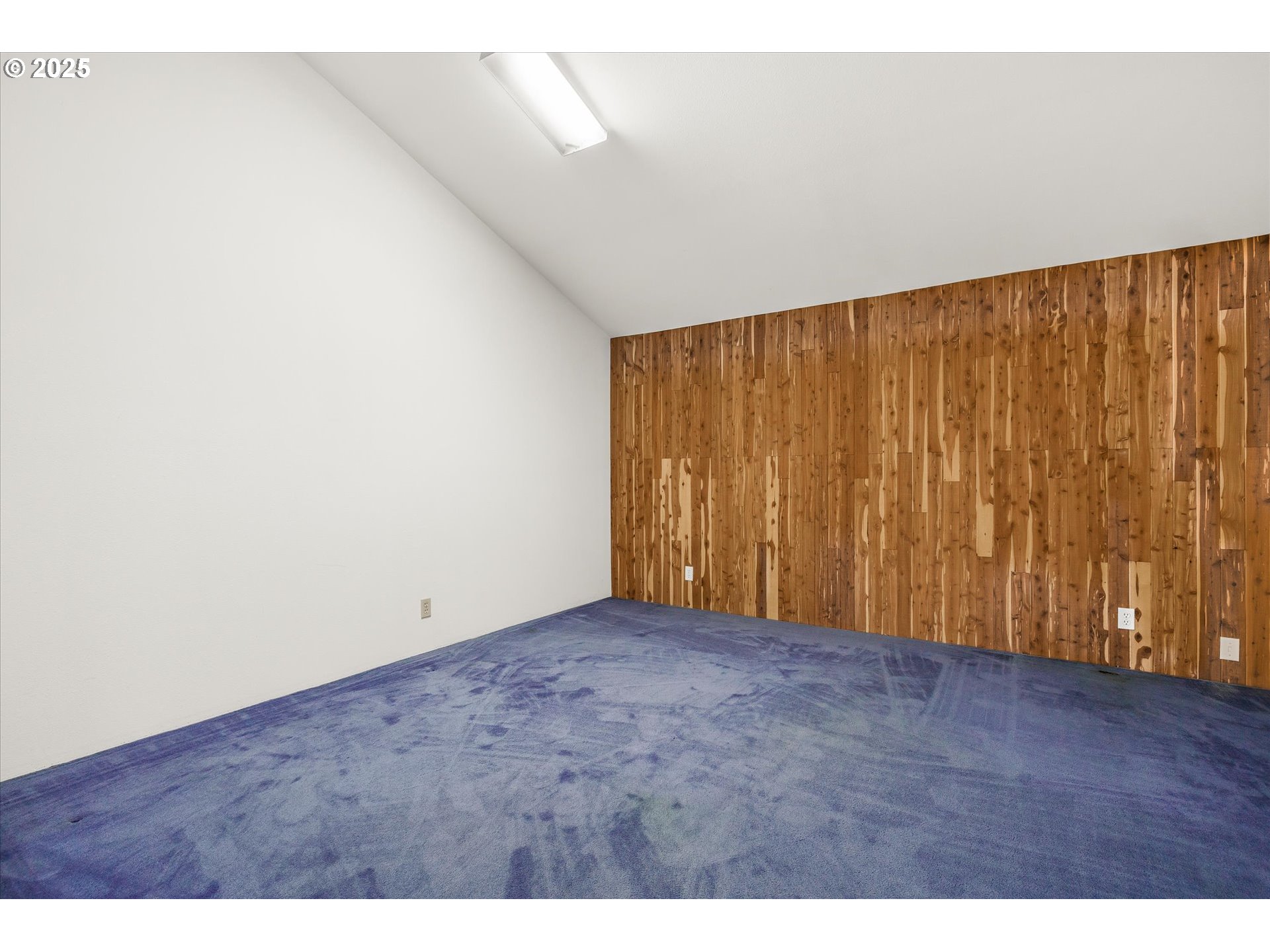 327 Lemwick Lane Yachats, OR 97498 - Photo 32 of 41 a view of an empty room with wooden floor