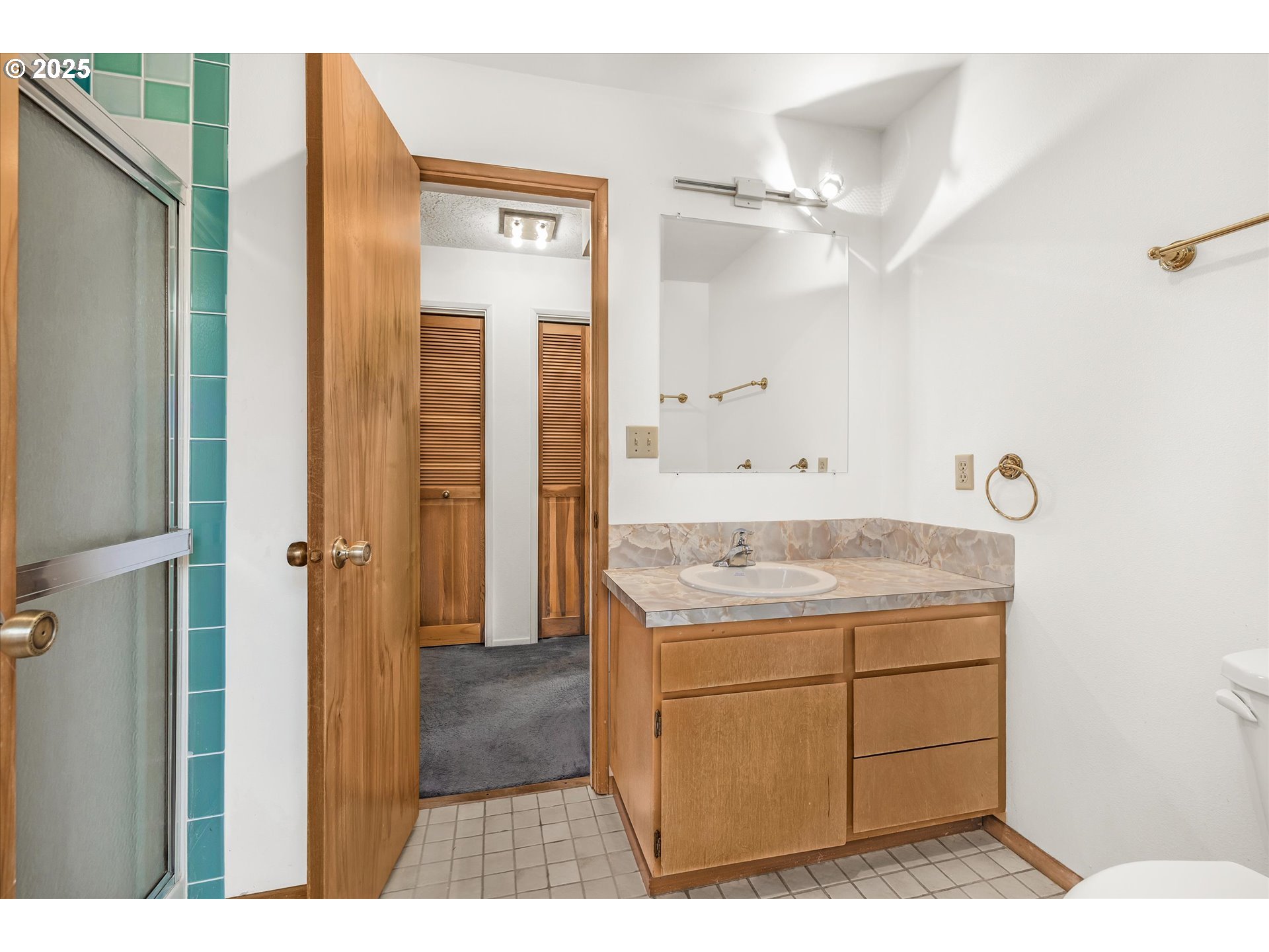 327 Lemwick Lane Yachats, OR 97498 - Photo 34 of 41 a bathroom with a granite countertop sink a mirror and a vanity