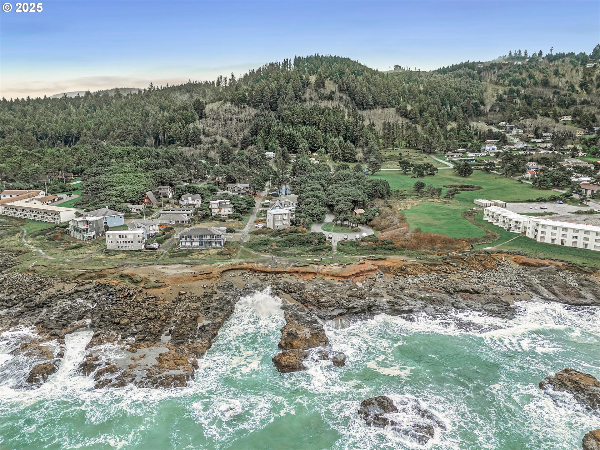 327 Lemwick Lane Yachats, OR 97498 - Photo 43 of 43 a view of a town with trees in the background