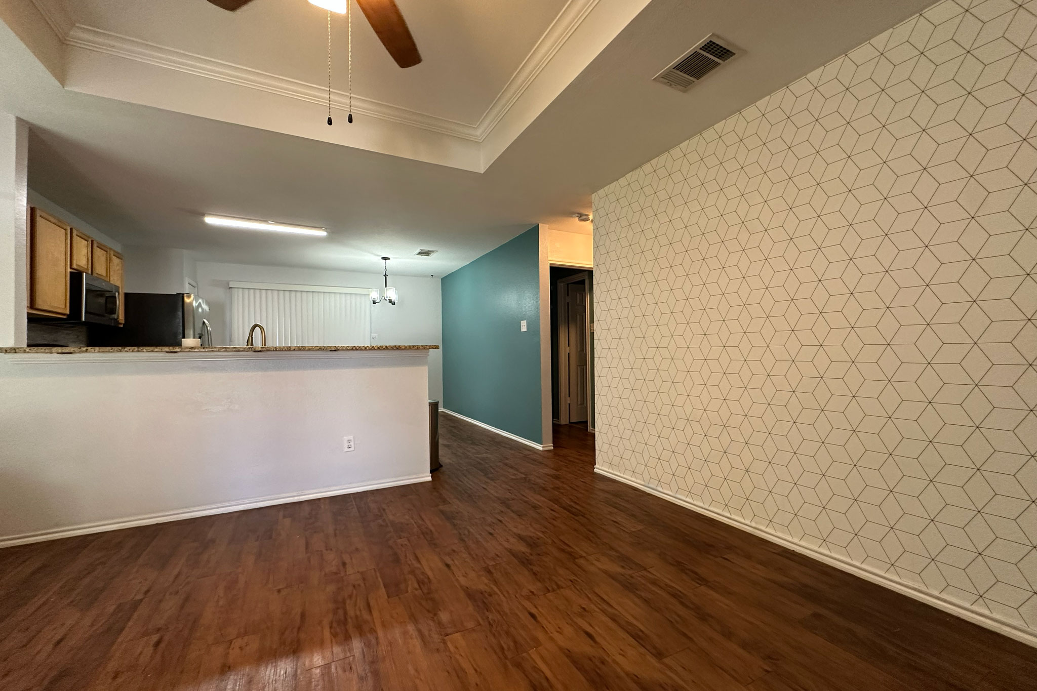 3309 Crownover Street Austin, TX 78725 - Photo 3 of 12 a view of a kitchen with wooden floor and a sink