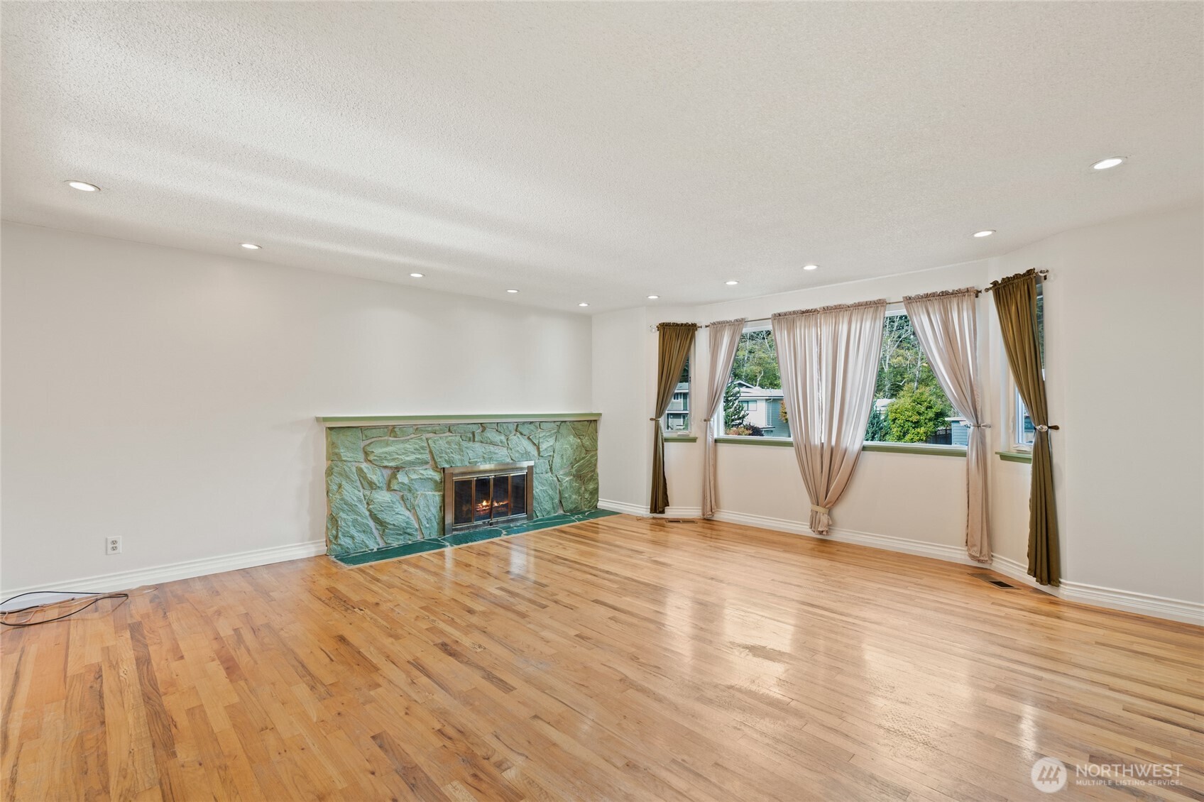 8506 224th Street Southwest Edmonds, WA 98026 - Photo 2 of 19 a view of an empty room with a window and wooden floor
