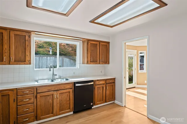 a kitchen with a sink and a window