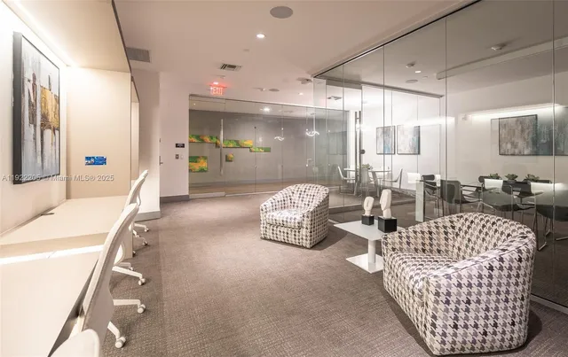 a living room with furniture a table and chairs