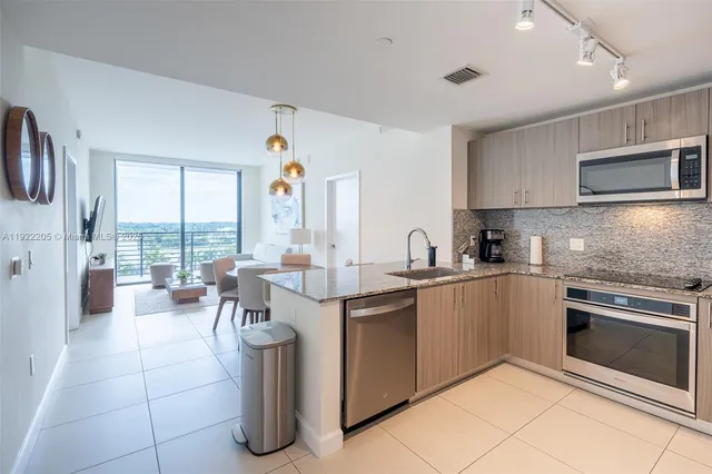 a kitchen with lots of counter top space and appliances