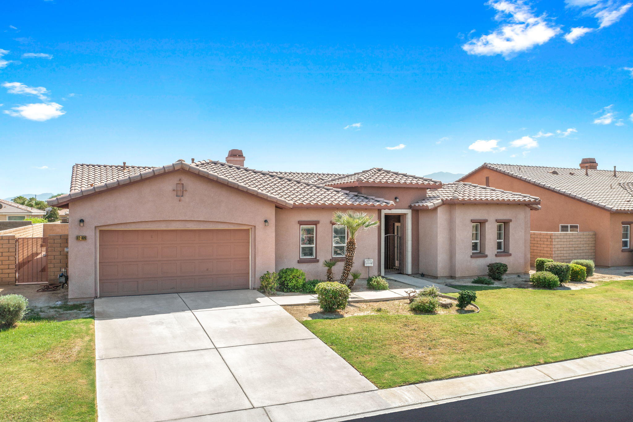 82809 Larsen Drive Indio, CA 92203 - Photo 1 of 34 a front view of house with yard space and swimming pool