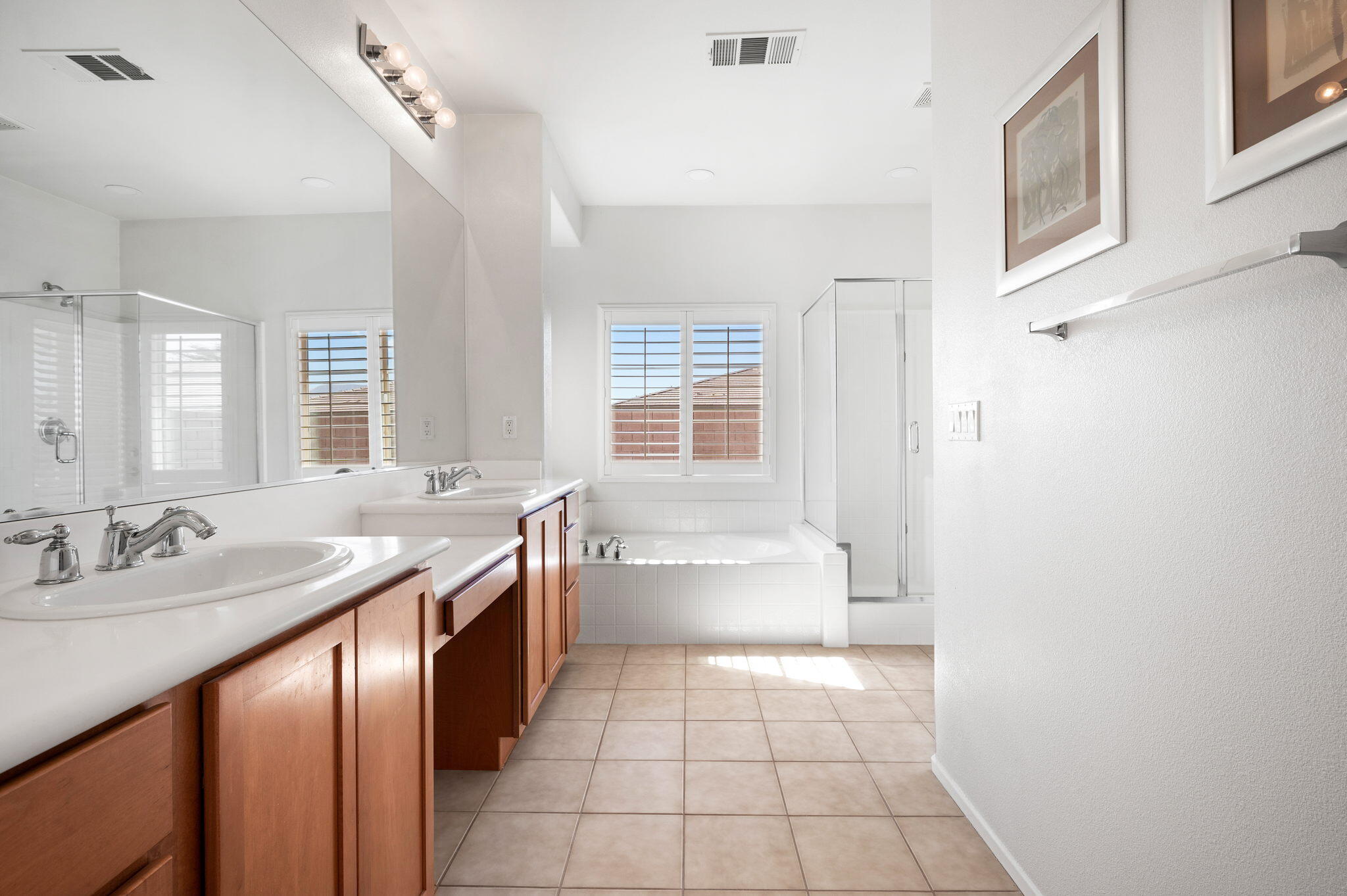 82809 Larsen Drive Indio, CA 92203 - Photo 21 of 34 a spacious bathroom with a granite countertop sink a toilet and bathtub