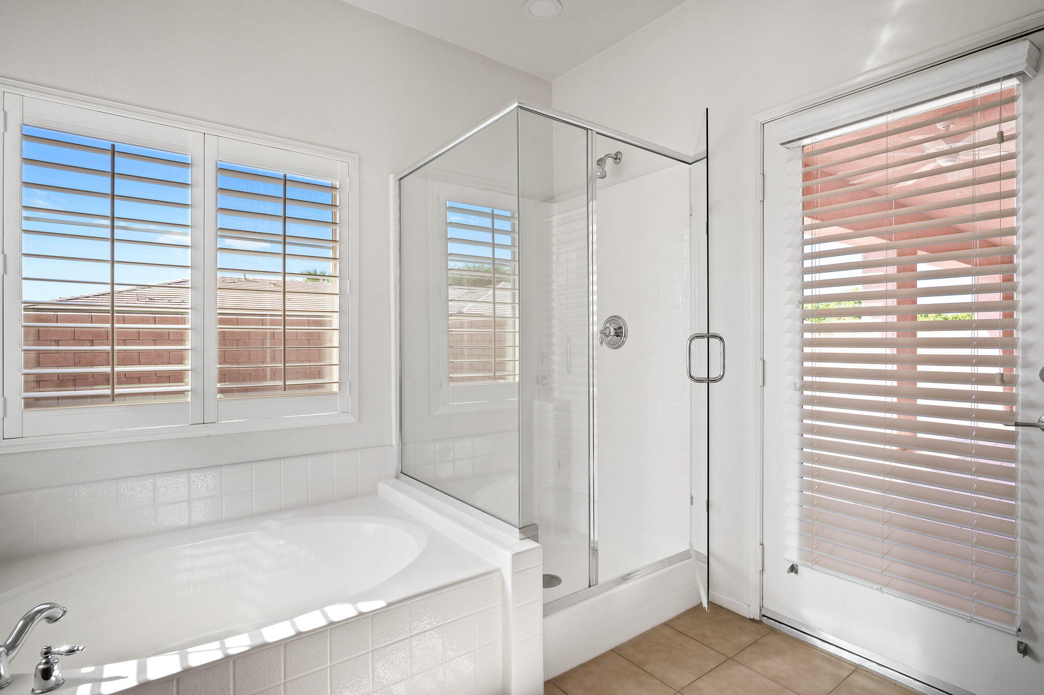 82809 Larsen Drive Indio, CA 92203 - Photo 22 of 34 a bathroom with a bathtub and a shower