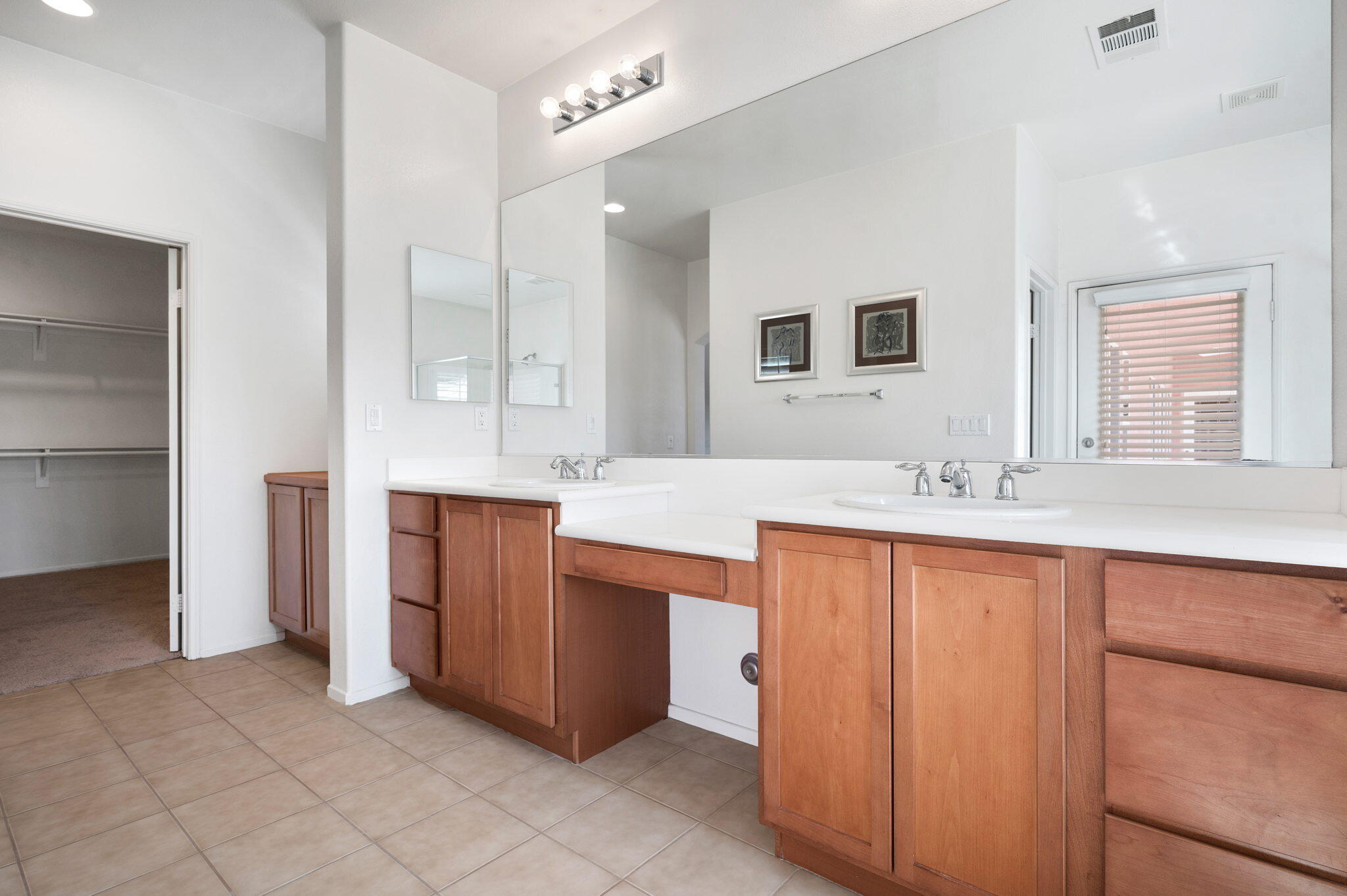 82809 Larsen Drive Indio, CA 92203 - Photo 23 of 34 a bathroom with a double vanity sink mirror and double