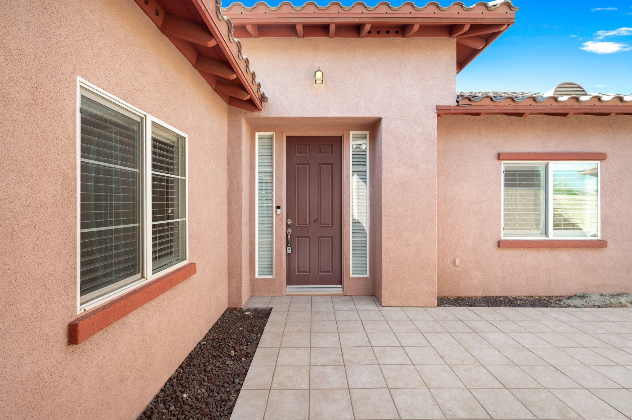 82809 Larsen Drive Indio, CA 92203 - Photo 26 of 34 a view of a house with a door and a window