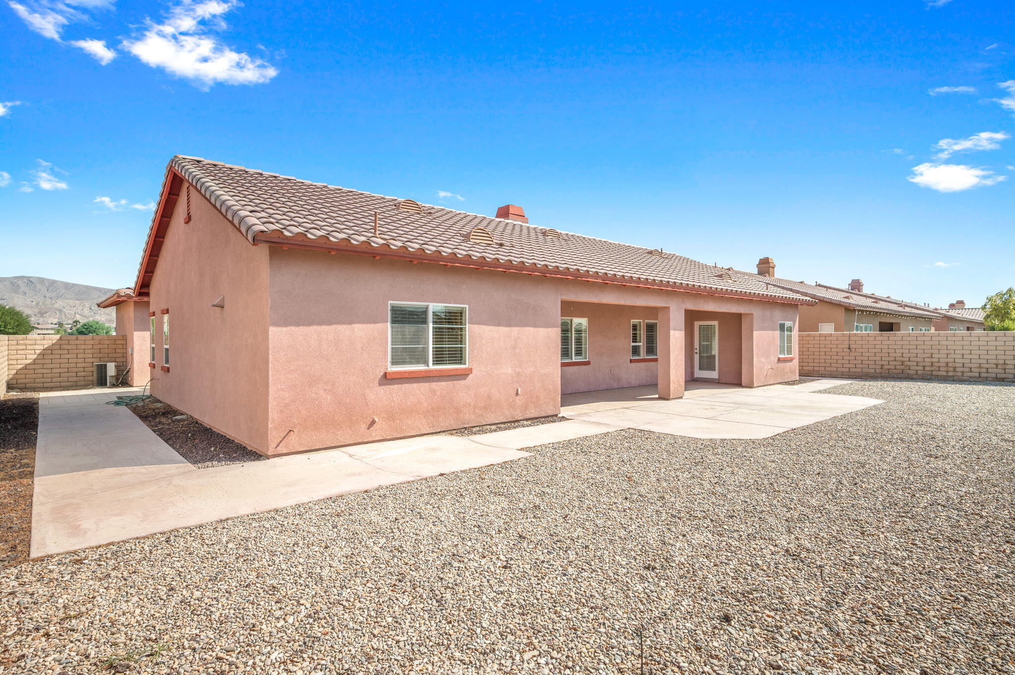 82809 Larsen Drive Indio, CA 92203 - Photo 30 of 34 a front view of a house with a yard