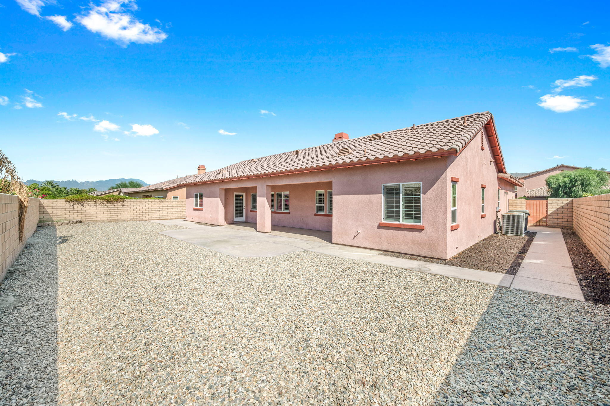 82809 Larsen Drive Indio, CA 92203 - Photo 33 of 34 a front view of a house with a yard
