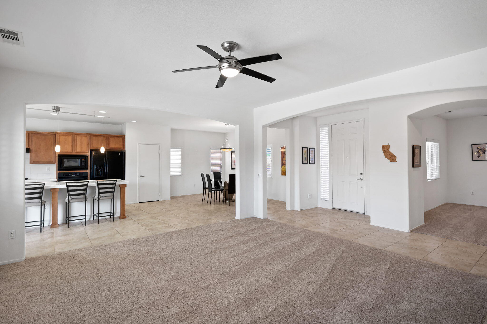 82809 Larsen Drive Indio, CA 92203 - Photo 4 of 34 a view of empty room with wooden floor and ceiling fan