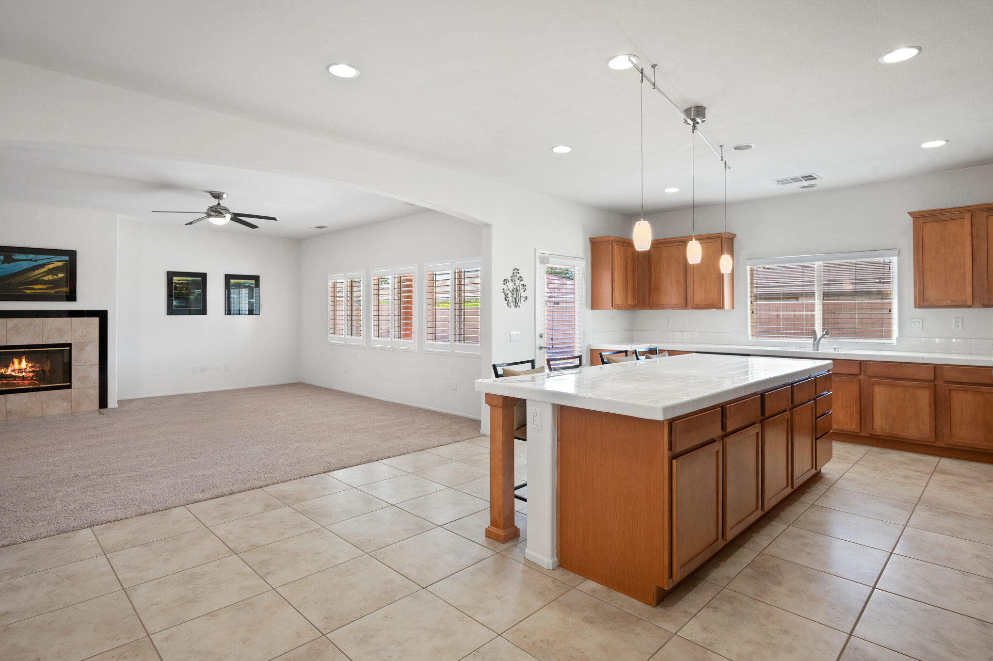 82809 Larsen Drive Indio, CA 92203 - Photo 5 of 34 a kitchen with stainless steel appliances granite countertop a sink and a stove