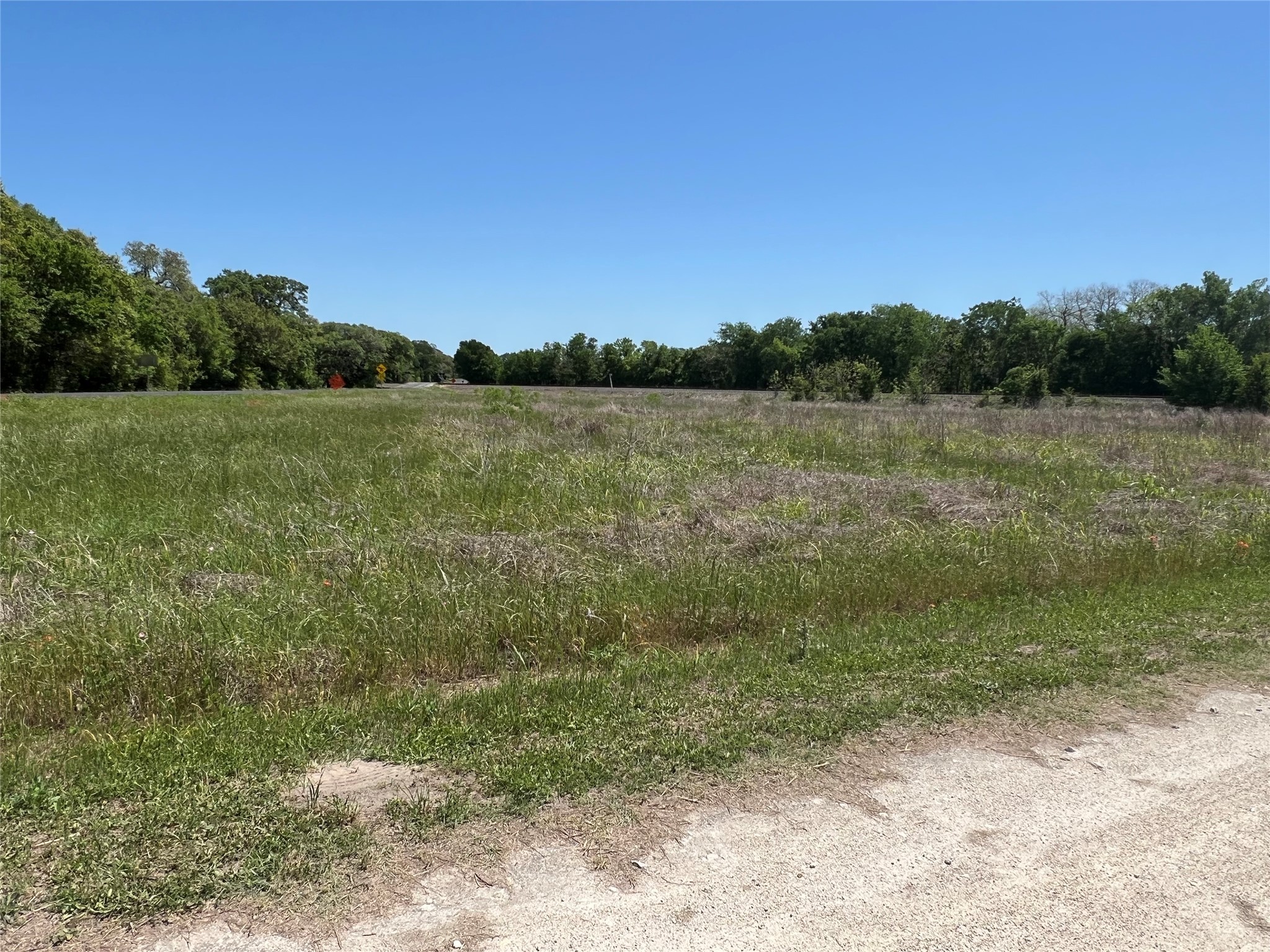 a view of lake with green space