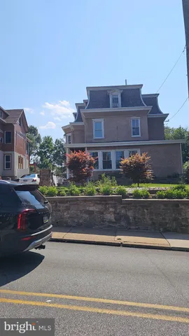 a room with wooden floor and furniture