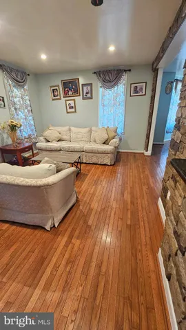 a kitchen with stainless steel appliances granite countertop a stove a sink dishwasher and a black cabinets