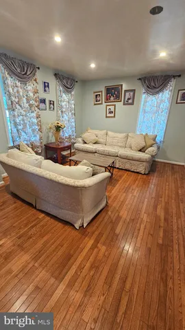 a kitchen with stainless steel appliances wooden cabinets and a stove top oven