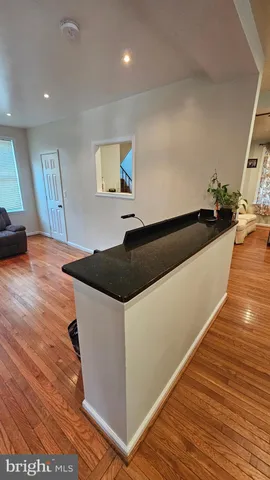 a spacious bedroom with two beds and a desk