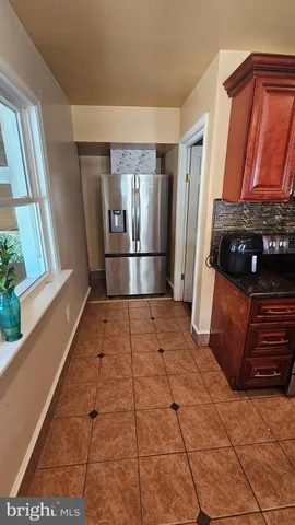 a view of a bathroom with a sink and a shower