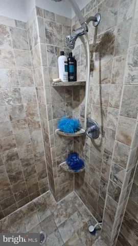 a view of a patio with table and chairs a barbeque and potted plants