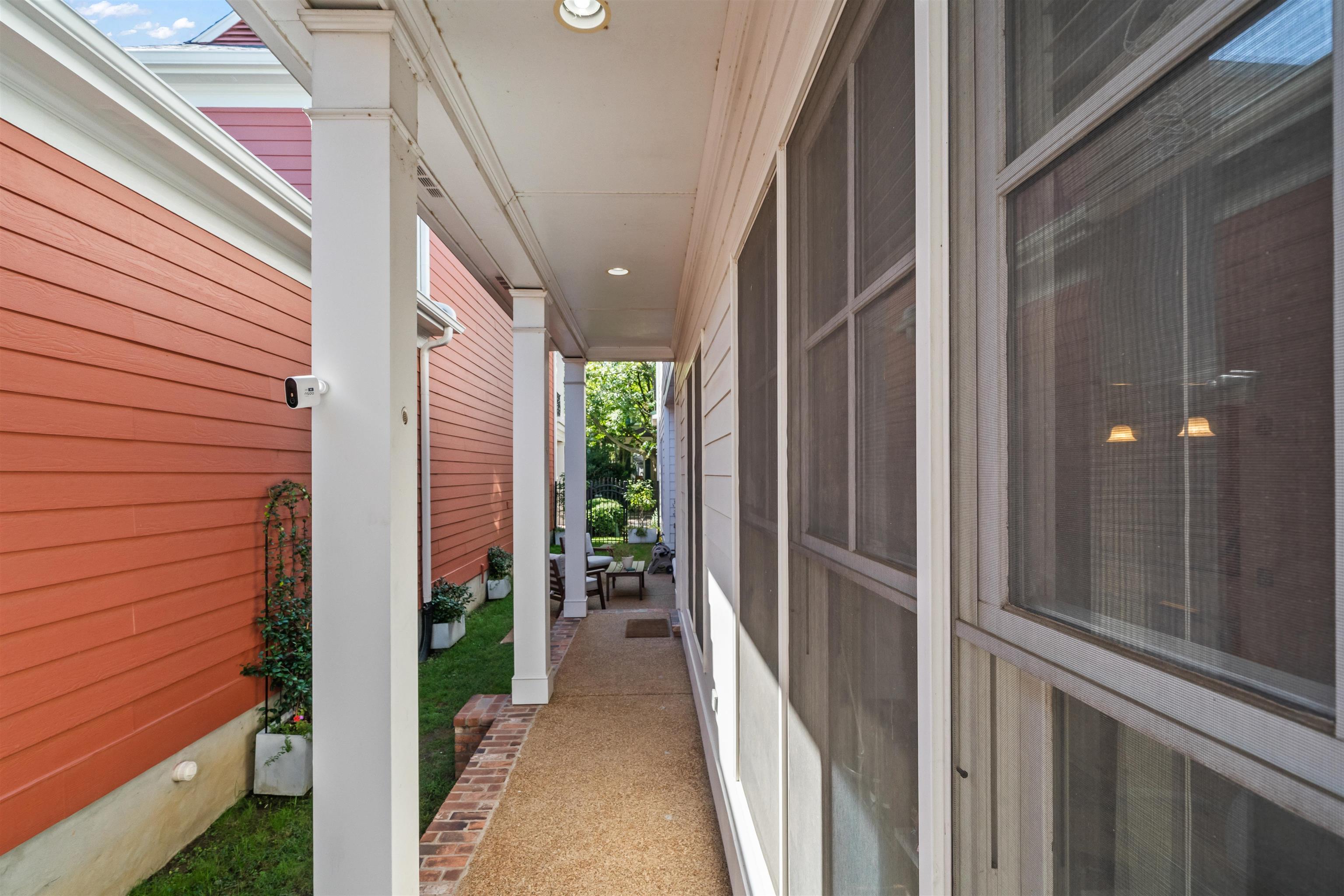 556 Rienzi Drive Memphis, TN 38103 - Photo 11 of 31 a view of a porch with wooden floor and stairs