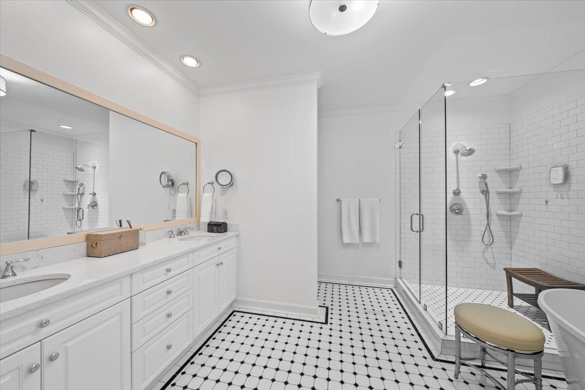 556 Rienzi Drive Memphis, TN 38103 - Photo 24 of 31 a spacious bathroom with a granite countertop sink a toilet a mirror and shower