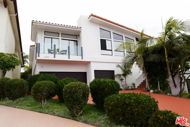a house view with a garden space