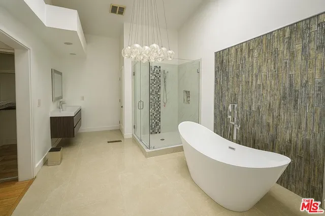 a bathroom with a bathtub and shower