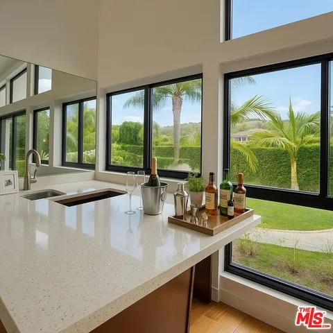 a view of a living room with furniture and floor to ceiling window