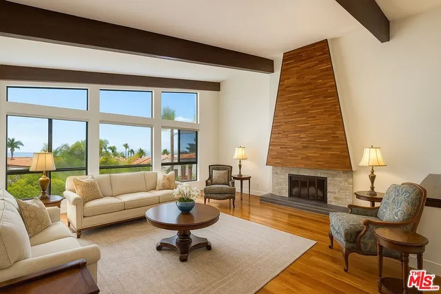 a living room with furniture or couch and a fireplace