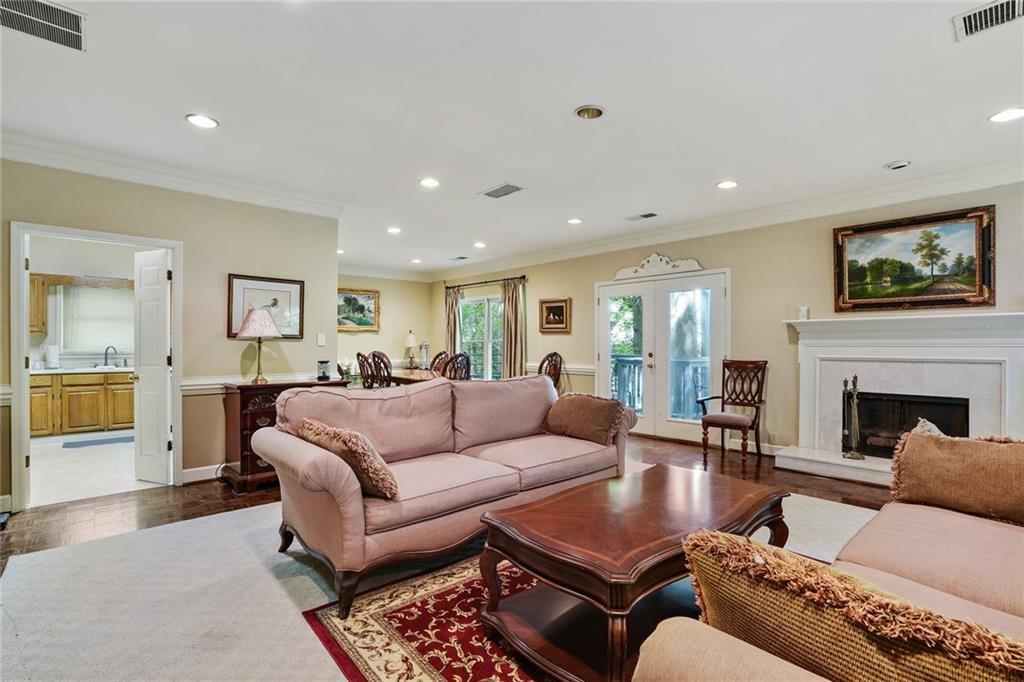 3203 Lenox Road Northeast, Unit 6 Atlanta, GA 30324 - Photo 27 of 27 a living room with furniture kitchen view and a fireplace