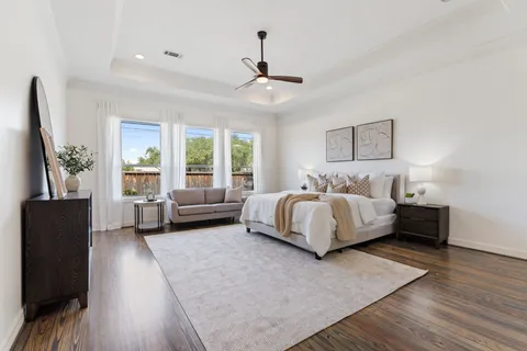 a bedroom with a large bed and a couch